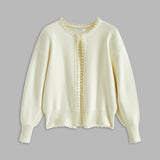 Cardigan med perlekant