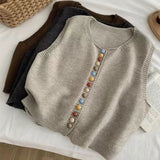 Maribel | Strikket vest med farverige knapper